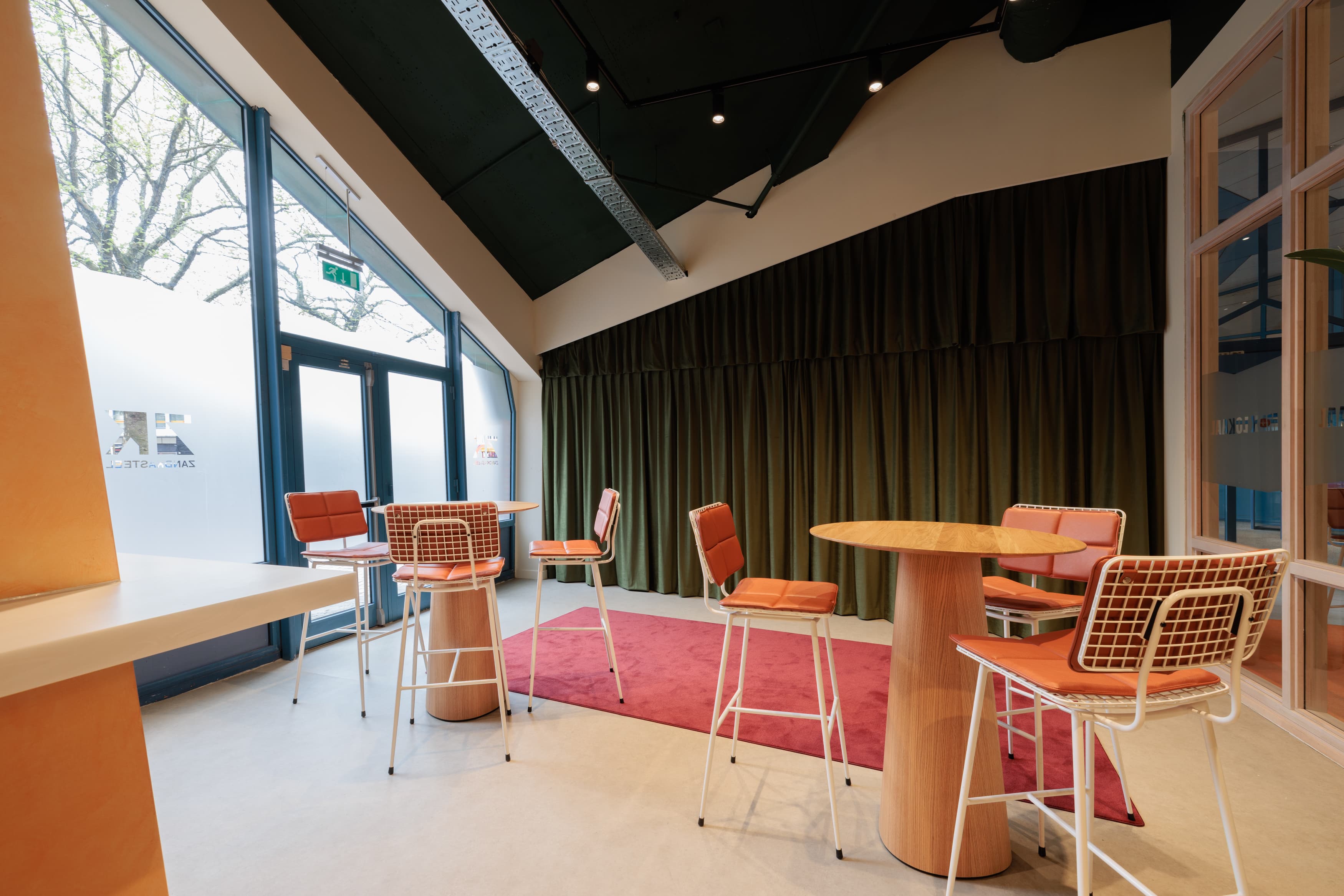 modern bar with high tables and chairs
